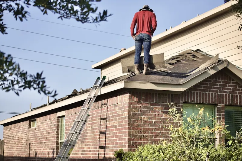 Professional roofer working on a residential roof in Indian Palms Country Club